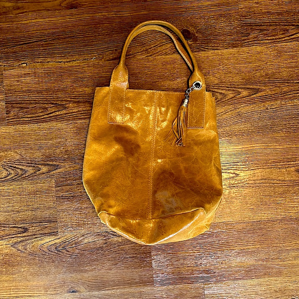 Genuine Leather you can smell. This is straight from Italy. Persaman.